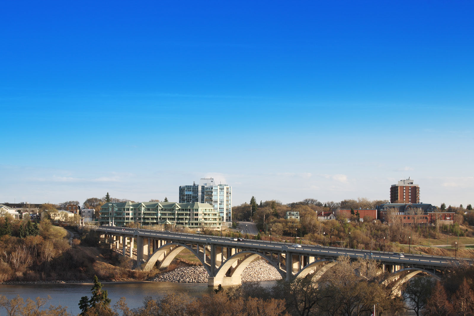 Enjoy a walk along the South Saskatchewan River from our Saskatoon hotel on a sunny day in spring.